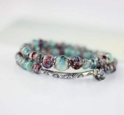 cosmic-curations-protective-ceramic-bead-silver-charm-bracelet